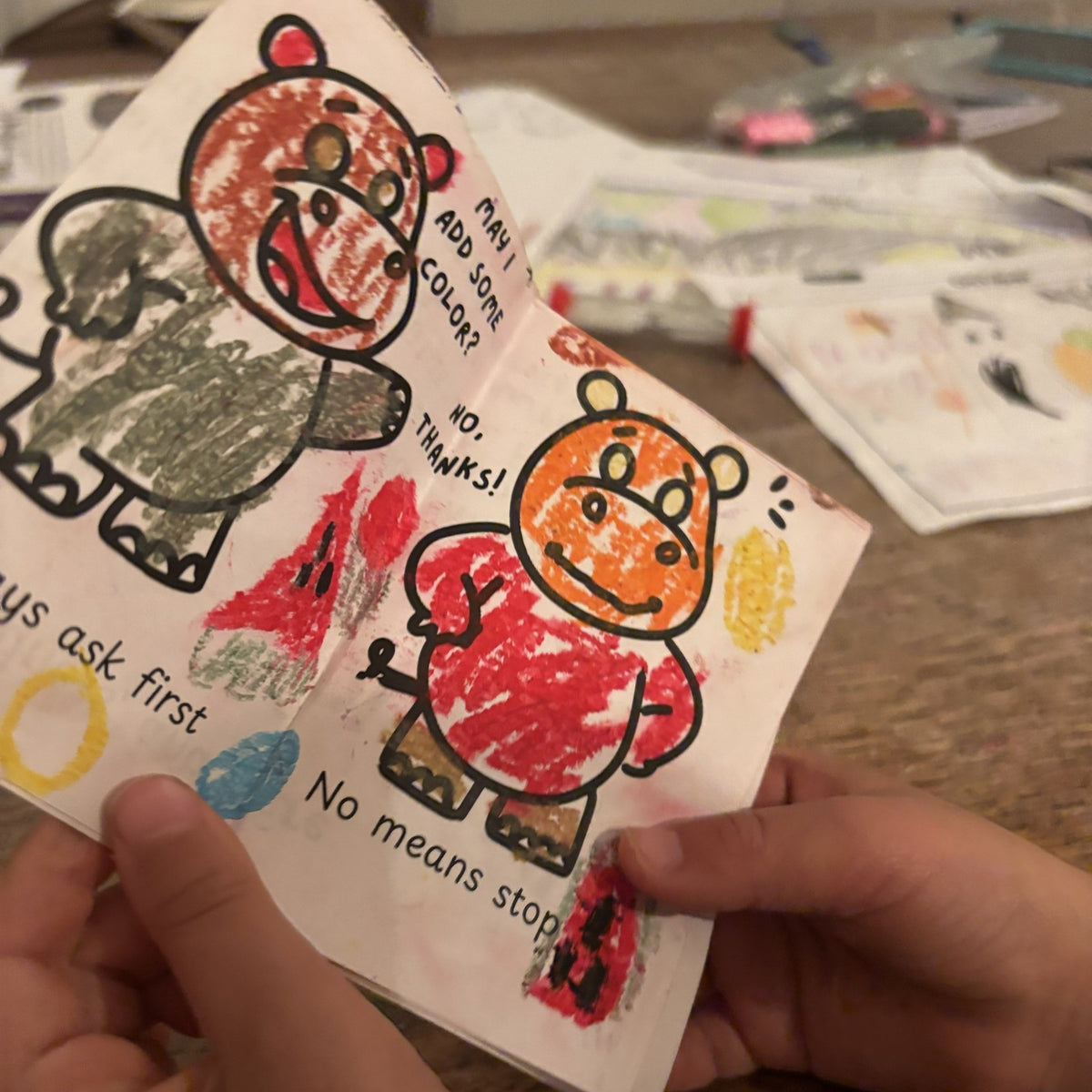 Inside spread with colored hippos: Always ask first, No means stop