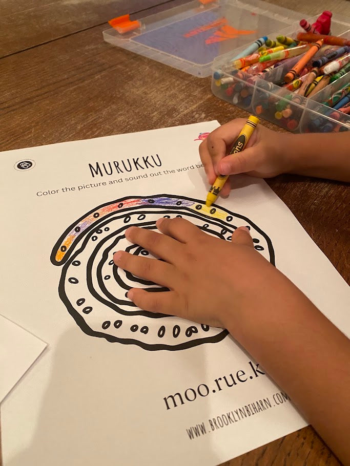 A child coloring one of the inside activity pages from My Indian Tea Party Activity Workbook where children color diverse ndian snacks.