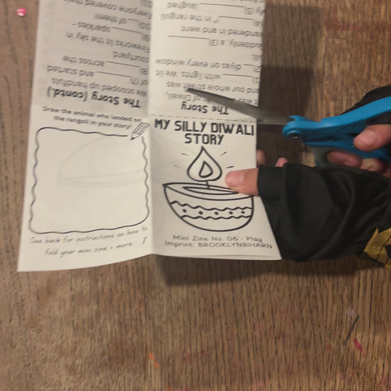 Cutting and folding the My Silly Diwali Story mini zine
