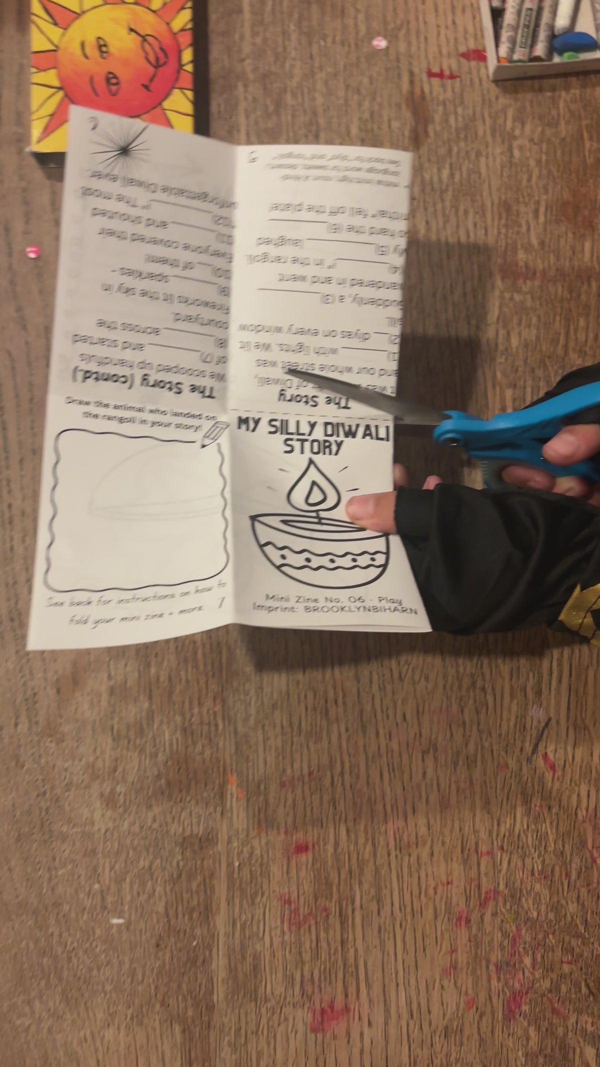 Cutting and folding the My Silly Diwali Story mini zine
