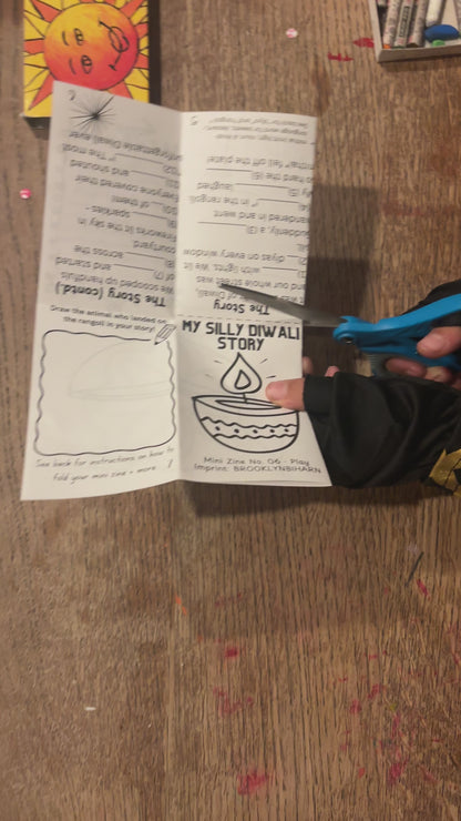 Cutting and folding the My Silly Diwali Story mini zine