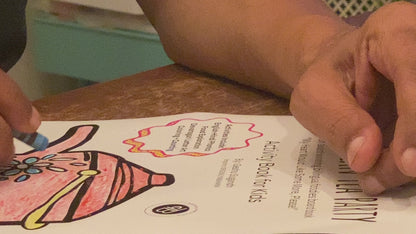 An adult aengaging in coloring activity of a chai pot from My Indian Tea Party Activity Workbook.